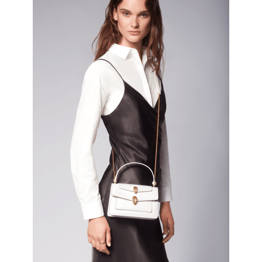 "Alexander Wang x Bvlgari" belt bag in smooth white calf leather. New double Serpenti head closure in antique gold-plated brass with tempting red enamel eyes. 288739 image 9