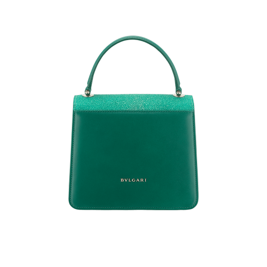 “Serpenti Forever ” crossbody bag in carmine jasper galuchat skin and calf leather. Iconic snakehead closure in light gold plated brass enriched with black and white enamel and green malachite eyes 752-Ga image 3