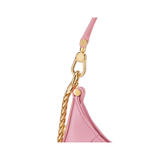 Serpenti Ellipse small crossbody bag in Urban grain and smooth flamingo quartz pink calf leather with flamingo quartz pink gros grain lining. Captivating snakehead closure in gold-plated brass embellished with black onyx scales and red enamel eyes. Online exclusive colour. 1204-Hobo image 5