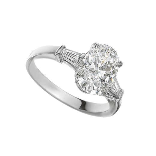 Griffe solitaire ring in platinum with oval shape diamond and two side diamonds. Available from 1 ct. A classic setting that allows the pureness and the beauty of the diamond to assert itself. 331858 image 1