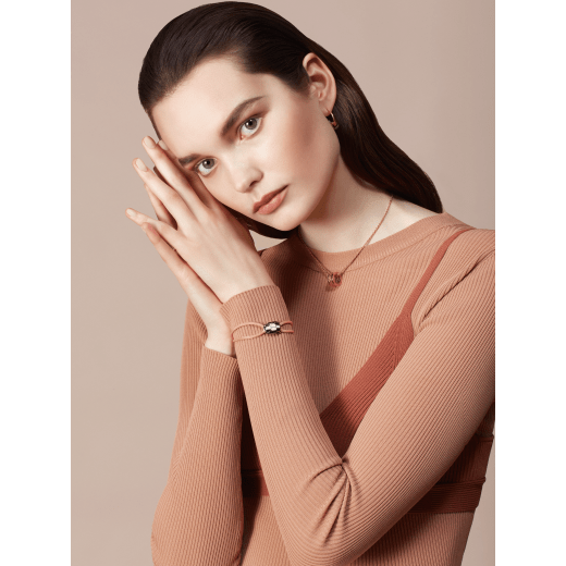 "Serpenti Forever" bracelet in Amaranth Garnet red fabric with a light gold-plated brass iconic snakehead décor enamelled in black and white agate, with seductive black enamel eyes. SERP-STRINGa image 2
