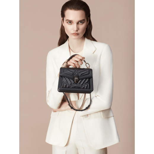 “Serpenti Diamond Blast” crossbody bag in Ivory Opal white quilted nappa leather body, featuring a maxi matelassé pattern, and black calf leather frames, with black nappa leather internal lining. Tempting snakehead closure in light gold plated brass enriched with black enamel and black onyx eyes. 1063-MFQD image 6
