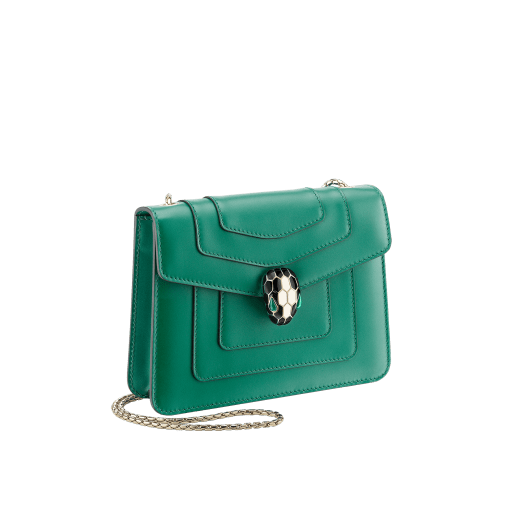 Serpenti Forever small crossbody bag in emerald green calf leather with amethyst purple grosgrain lining. Captivating snakehead closure in light gold-plated brass embellished with black and white agate enamel scales and green malachite eyes. 422-CLa image 2