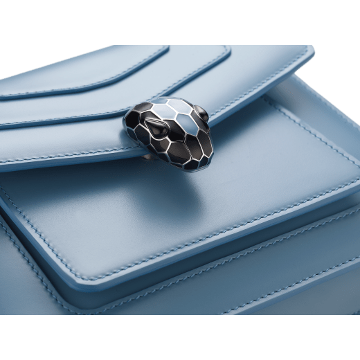 Serpenti Forever small crossbody bag in Niagara sapphire blue calf leather with silky coral pink grosgrain lining. Captivating snakehead closure in palladium-plated brass, embellished with black and Niagara sapphire blue enamel scales and black onyx eyes. 1184-CL image 4