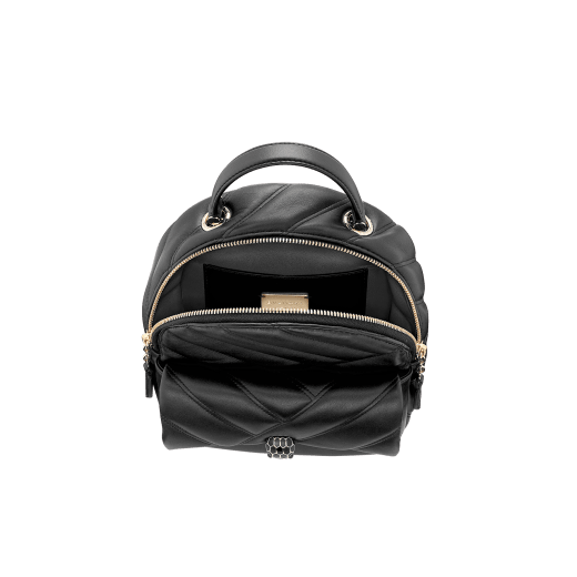 Serpenti Cabochon backpack in soft quilted white agate calf leather, with a graphic motif. Light gold plated brass tempting snake head closure in black and white agate enamel and black onyx eyes. 1009-NSM image 4
