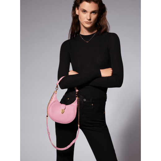 Serpenti Ellipse small crossbody bag in Urban grain and smooth flamingo quartz pink calf leather with flamingo quartz pink gros grain lining. Captivating snakehead closure in gold-plated brass embellished with black onyx scales and red enamel eyes. Online exclusive colour. 1204-Hobo image 8
