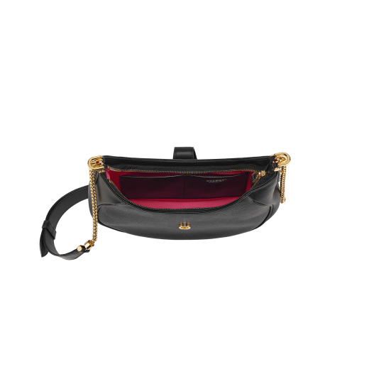 Serpenti Ellipse medium shoulder bag in Urban grain and smooth Niagara sapphire blue calf leather with cloud topaz blue gros grain lining. Captivating snakehead closure in gold-plated brass embellished with black onyx scales and red enamel eyes. 1190-UCL image 4
