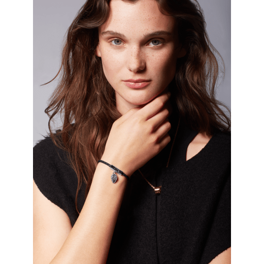 Serpenti Forever bracelet in black braided calf leather. Captivating snakehead charm in dark ruthenium-plated brass, complete with red enamel eyes, attached to the clasp at the front. SERPHERBRAID-WCL-B image 2