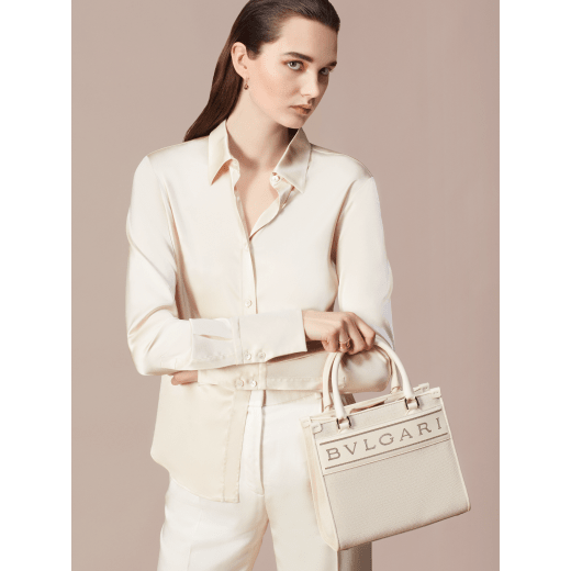 "Bvlgari Logo" small tote bag in Ivory Opal white canvas, with Beet Amethyst purple grosgrain inner lining. Bvlgari logo featured with light gold-plated brass chain inserts on the Ivory Opal white calf leather. BVL-1159-CC image 5