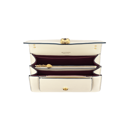 "Serpenti Forever" maxi chain crossbody bag in Ivory Opal white nappa leather, with an Deep Garnet bordeaux nappa leather internal lining. New Serpenti head closure in gold-plated brass, finished with small grey mother-of-pearl scales in the middle, and red enamel eyes. 1138-MCNb image 4