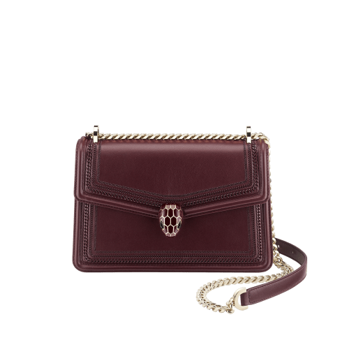 “Serpenti Diamond Blast” shoulder bag in Deep Garnet bordeuax smooth calf leather, featuring a tone-on-tone 3-Maxi Chain motif, with Deep Garnet bordeaux nappa leather internal lining. Tempting snakehead closure in light gold plated brass, enriched with Deep Garnet bordeaux enamel and black onyx eyes. 922-3MCFCL image 1