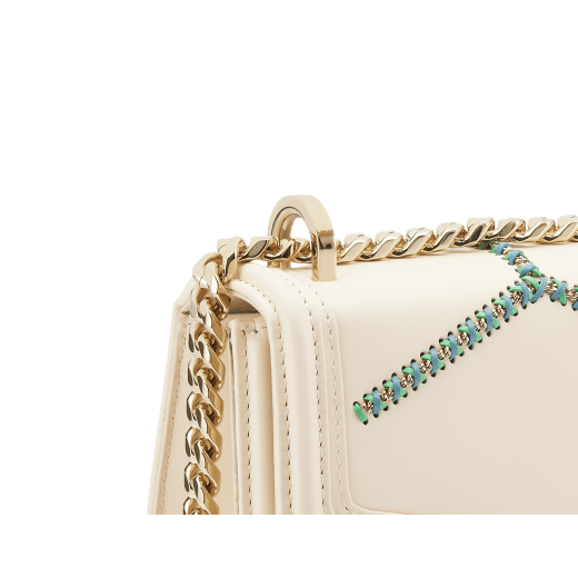 Serpenti Diamond Blast small shoulder bag in ivory opal calf leather with twisted chain and leather décor, and Niagara sapphire blue nappa leather lining. Captivating snakehead closure in light gold-plated brass embellished with matt and shiny ivory opal enamel scales and black onyx eyes. 291725 image 5