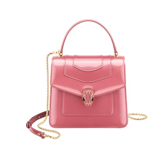 “Serpenti Forever” top handle bag in Blush Quartz pink calf leather with a varnished and pearled effect, and black gros grain internal lining. Tempting snakehead closure in gold plated brass, enriched with matte Blush Quartz pink enamel and black onyx eyes. 290943 image 1