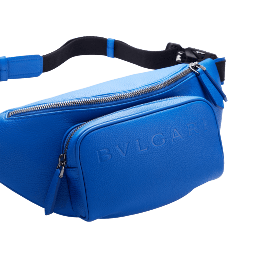 BULGARI Man small belt bag in Olympian sapphire blue smooth and grainy metal-free calf leather with Olympian sapphire blue regenerated nylon (ECONYL®) lining. Dark ruthenium-plated brass hardware, hot stamped BULGARI logo and zipped closure. BMA-1209-CL image 7