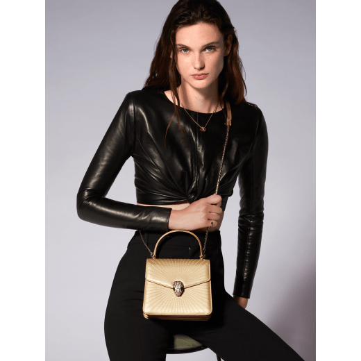 Serpenti Forever top handle bag in ivory opal laser-cut calf leather with caramel topaz beige nappa leather lining. Captivating snakehead closure in light gold-plated brass embellished with matt and shiny ivory opal enamel scales and black onyx eyes. 752-LCL image 6