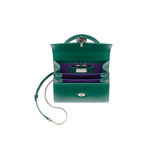 “Serpenti Forever ” crossbody bag in carmine jasper galuchat skin and calf leather. Iconic snakehead closure in light gold plated brass enriched with black and white enamel and green malachite eyes 752-Ga image 4