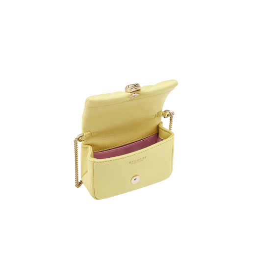 Serpenti Cabochon micro bag in ivory opal calf leather with a maxi matelassé pattern and black nappa leather lining. Captivating snakehead closure in gold-plated brass embellished with red enamel eyes. SCB-NANOCABOCHON image 2