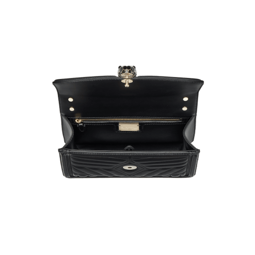 “Serpenti Diamond Blast” shoulder bag in black quilted nappa leather body, featuring a maxi matelassé pattern, and black calf leather frames, with black nappa leather internal lining. Tempting snakehead closure in light gold plated brass enriched with black enamel and black onyx eyes. 922-MFQD image 4