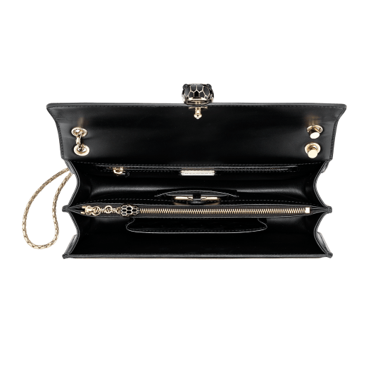“Serpenti Forever” shoulder bag in black calf leather and Million chain frame body and black calf leather sides. Iconic snake head closure in light gold plated brass enriched with black enamel and black onyx eyes. 521-GCP image 4