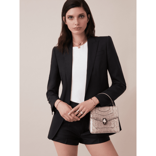 Serpenti Forever small top handle bag in white agate metallic karung skin with black nappa leather lining. Captivating snakehead closure in light gold-plated brass embellished with black and white agate enamel scales and black onyx eyes. 1122-MK image 5