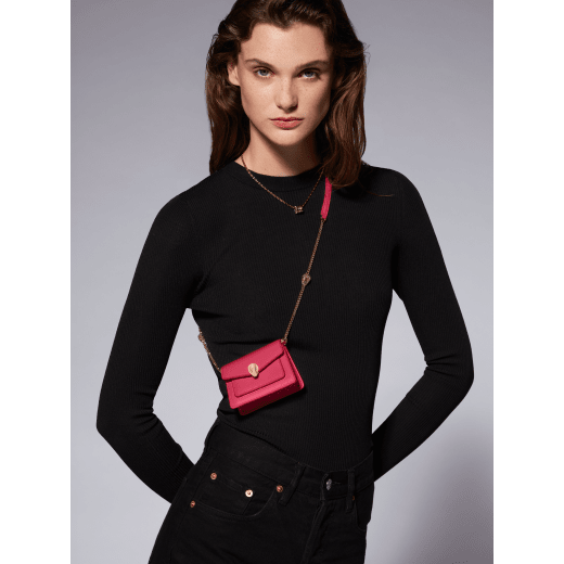 Serpenti Forever micro bag in amaranth garnet red calf leather. Captivating snakehead closure in light gold-plated brass embellished with red enamel eyes. SEA-MICROXBODY image 5