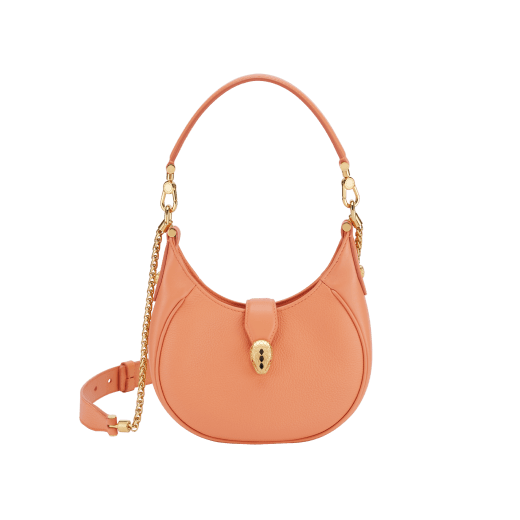 Serpenti Ellipse small crossbody bag in Urban grain and smooth flamingo quartz pink calf leather with flamingo quartz pink gros grain lining. Captivating snakehead closure in gold-plated brass embellished with black onyx scales and red enamel eyes. Online exclusive colour. 1204-Hobo image 1