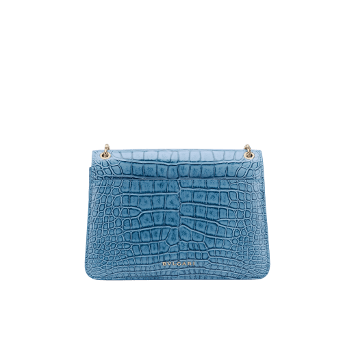 Serpenti Forever shoulder bag in Niagara sapphire blue Cloudy alligator skin with black nappa leather lining. Captivating snakehead closure in light gold-plated brass embellished with black enamel scales, blue jade scales in the centre and black onyx eyes. 291478 image 3