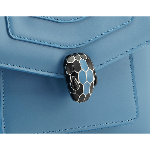 Serpenti Forever small crossbody bag in Niagara sapphire blue calf leather with silky coral pink grosgrain lining. Captivating snakehead closure in palladium-plated brass, embellished with black and Niagara sapphire blue enamel scales and black onyx eyes. 1184-CL image 6