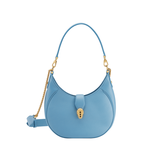 Serpenti Ellipse medium shoulder bag in Urban grain and smooth Niagara sapphire blue calf leather with cloud topaz blue gros grain lining. Captivating snakehead closure in gold-plated brass embellished with black onyx scales and red enamel eyes. 1190-UCL image 1