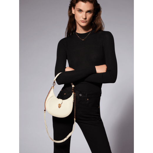 Serpenti Ellipse small crossbody bag in Urban grain and smooth flamingo quartz pink calf leather with flamingo quartz pink gros grain lining. Captivating snakehead closure in gold-plated brass embellished with black onyx scales and red enamel eyes. Online exclusive colour. 1204-Hobo image 8