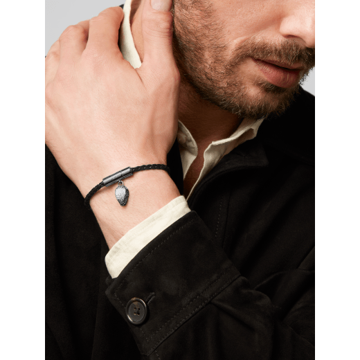 Serpenti Forever bracelet in black braided calf leather. Captivating snakehead charm in dark ruthenium-plated brass, complete with red enamel eyes, attached to the clasp at the front. SERPHERBRAID-WCL-B image 3
