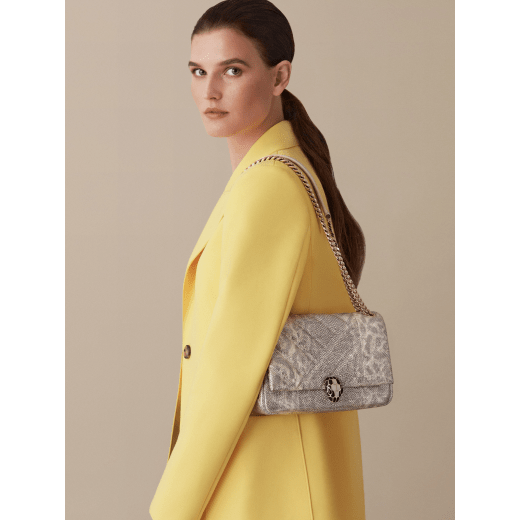 Serpenti Cabochon small shoulder bag in milky opal beige matelassé metallic karung skin with milky opal beige nappa leather lining. Captivating snakehead closure in light gold-plated brass embellished with matt black and glitter milky opal beige enamel scales and black onyx eyes. 1094-MK image 4