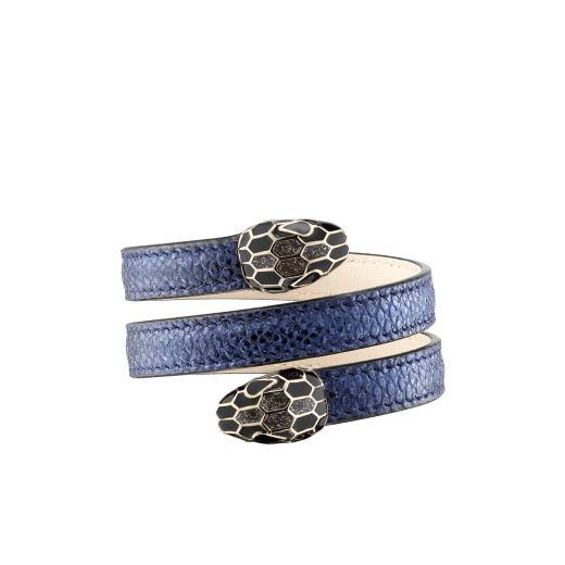 "Serpenti Forever" multi-coiled Cleopatra bangle in precious, metallic Midnight Sapphire blue karung skin with light gold-plated brass details. Iconic double snakehead with black and glittery Hawk's Eye grey enamel and seductive black enamel eyes. Cleopatra-MK-MidSapph image 1