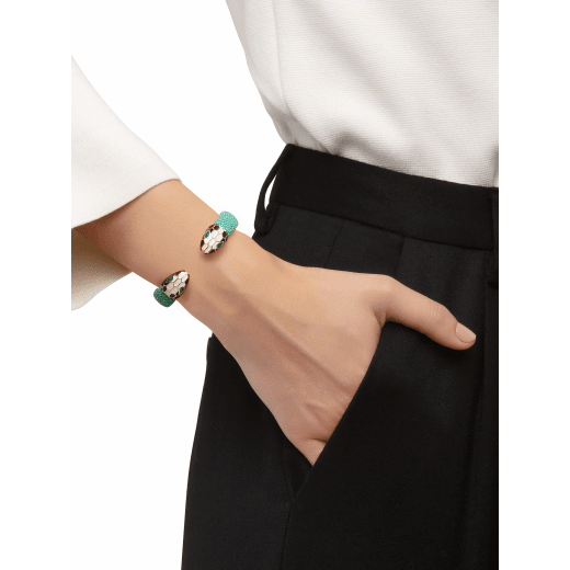 Green galuchat skin bracelet with contraire brass light gold plated iconic black and white enamel Serpenti head motif with malachite enamel eyes. Small. Also available in other colors in store. 2 (5.3 cm) SPContr-G-EG image 2