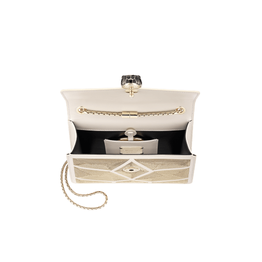 “Serpenti Forever” crossbody bag in black calf leather with a Million Chain motif. Iconic snake head closure in light gold plated brass enriched with black enamel and black onyx eyes. 422-CP image 4