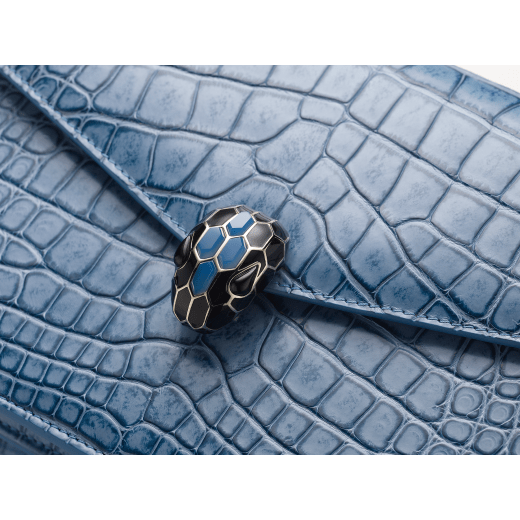 Serpenti Forever shoulder bag in Niagara sapphire blue Cloudy alligator skin with black nappa leather lining. Captivating snakehead closure in light gold-plated brass embellished with black enamel scales, blue jade scales in the centre and black onyx eyes. 291478 image 4