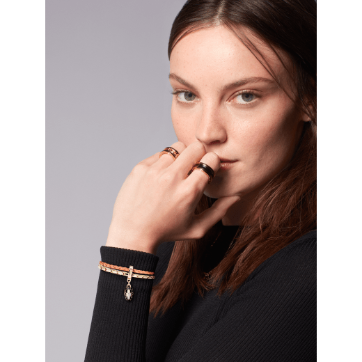 Serpenti Forever bracelet in coral carnelian orange braided calf leather, with light gold-plated brass chain and magnetic clasp closure. Captivating snakehead charm with black and white agate enamel scales and black enamel eyes. SERPBRAIDCHAIN-WCL-CC image 2