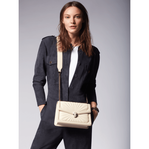 Serpenti Diamond Blast small shoulder bag in ivory opal Sunshine quilted nappa leather with black nappa leather lining. Captivating snakehead closure in light gold-plated brass embellished with matt and shiny ivory opal enamel scales and black onyx eyes. 922-SQ image 8