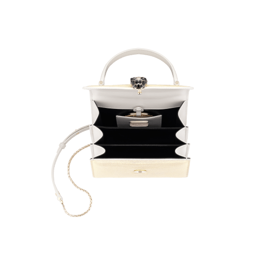 “Serpenti Forever” crossbody bag in Milky Opal beige galuchat skin with agate-white calfskin edges and black nappa leather inner lining. Alluring snakehead closure in light gold-plated brass enriched with black and pearly, agate-white enamel and black onyx eyes. 752-CG image 2