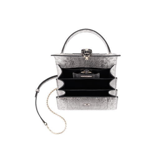 Serpenti Forever small top handle bag in white agate metallic karung skin with black nappa leather lining. Captivating snakehead closure in light gold-plated brass embellished with black and white agate enamel scales and black onyx eyes. 1122-MK image 4