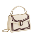 “Serpenti Diamond Blast” crossbody bag in Ivory Opal white smooth calf leather, featuring an Deep Garnet bordeaux 3-Maxi Chain motif, with Deep Garnet bordeaux nappa leather internal lining. Tempting snakehead closure in light gold plated brass, enriched with Deep Garnet bordeaux and Ivory Opal white enamel and black onyx eyes. 291175 image 2