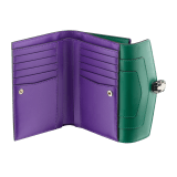 Serpenti Forever large wallet in emerald green calf leather with violet amethyst nappa leather interior. Captivating snakehead press button closure in light gold-plated brass embellished with black and white agate enamel scales and green malachite eyes. 291854 image 2