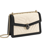“Serpenti Diamond Blast” shoulder bag in black quilted nappa leather body, featuring a maxi matelassé pattern, and black calf leather frames, with black nappa leather internal lining. Tempting snakehead closure in light gold plated brass enriched with black enamel and black onyx eyes. 922-MFQD image 2
