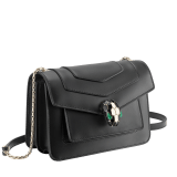 Serpenti Forever small crossbody bag in emerald green calf leather with amethyst purple grosgrain lining. Captivating snakehead closure in light gold-plated brass embellished with black and white agate enamel scales and green malachite eyes. 1082-CLa image 2