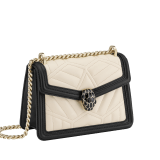 “Serpenti Diamond Blast” crossbody bag in Ivory Opal white quilted nappa leather body, featuring a maxi matelassé pattern, and black calf leather frames, with black nappa leather internal lining. Tempting snakehead closure in light gold plated brass enriched with black enamel and black onyx eyes. 1063-MFQD image 2