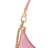 Serpenti Ellipse small crossbody bag in Urban grain and smooth flamingo quartz pink calf leather with flamingo quartz pink gros grain lining. Captivating snakehead closure in gold-plated brass embellished with black onyx scales and red enamel eyes. Online exclusive colour. 1204-Hobo image 5