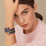 "Serpenti Forever" multi-coiled Cleopatra bangle in precious, metallic Midnight Sapphire blue karung skin with light gold-plated brass details. Iconic double snakehead with black and glittery Hawk's Eye grey enamel and seductive black enamel eyes. Cleopatra-MK-MidSapph image 2