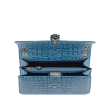 Serpenti Forever shoulder bag in Niagara sapphire blue Cloudy alligator skin with black nappa leather lining. Captivating snakehead closure in light gold-plated brass embellished with black enamel scales, blue jade scales in the centre and black onyx eyes. 291478 image 5