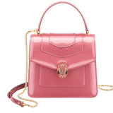 “Serpenti Forever” top handle bag in Blush Quartz pink calf leather with a varnished and pearled effect, and black gros grain internal lining. Tempting snakehead closure in gold plated brass, enriched with matte Blush Quartz pink enamel and black onyx eyes. 290943 image 1