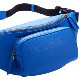 BULGARI Man small belt bag in Olympian sapphire blue smooth and grainy metal-free calf leather with Olympian sapphire blue regenerated nylon (ECONYL®) lining. Dark ruthenium-plated brass hardware, hot stamped BULGARI logo and zipped closure. BMA-1209-CL image 7